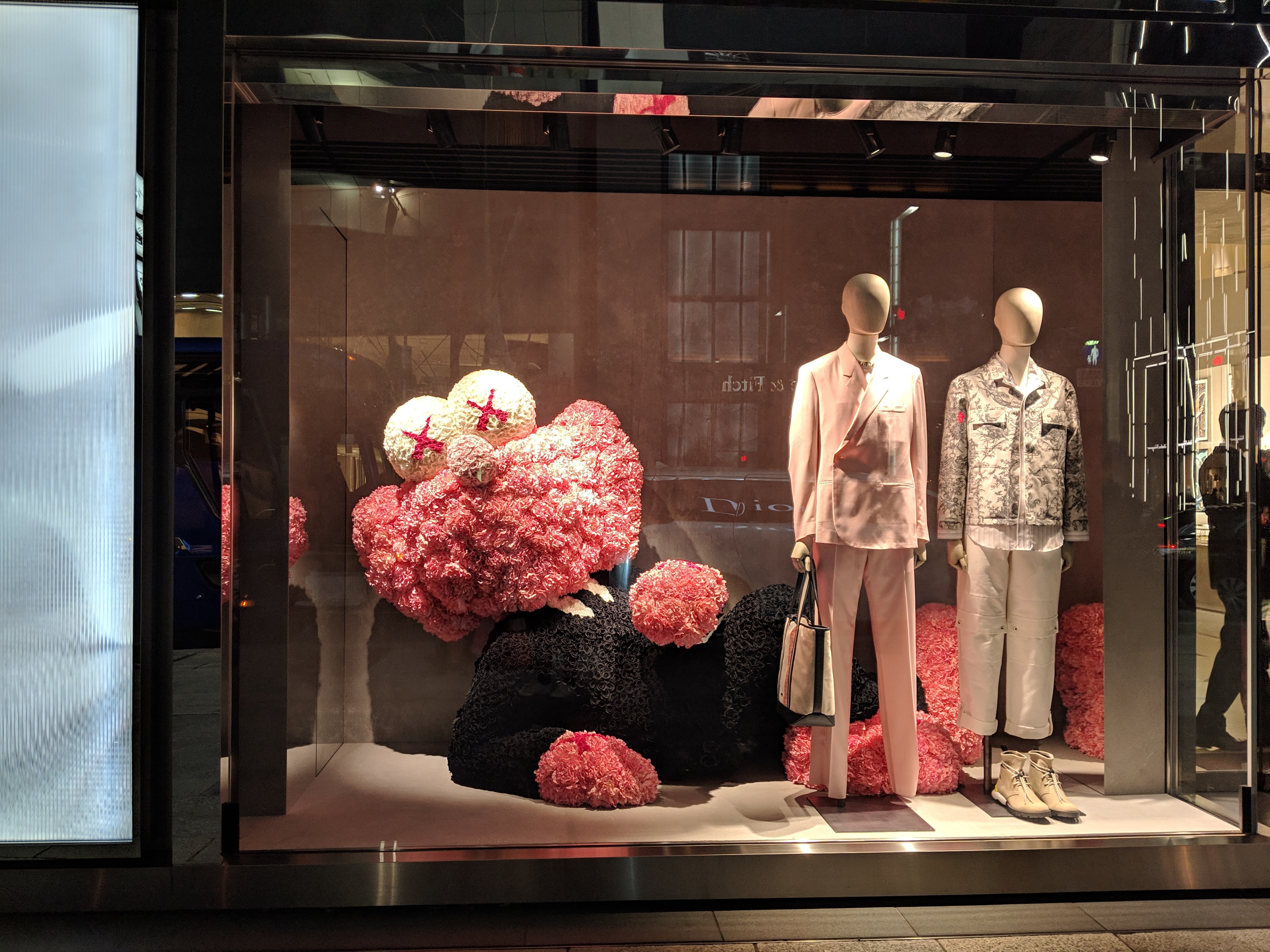 A KAWS art piece in a store window for... I think it was Fendi?