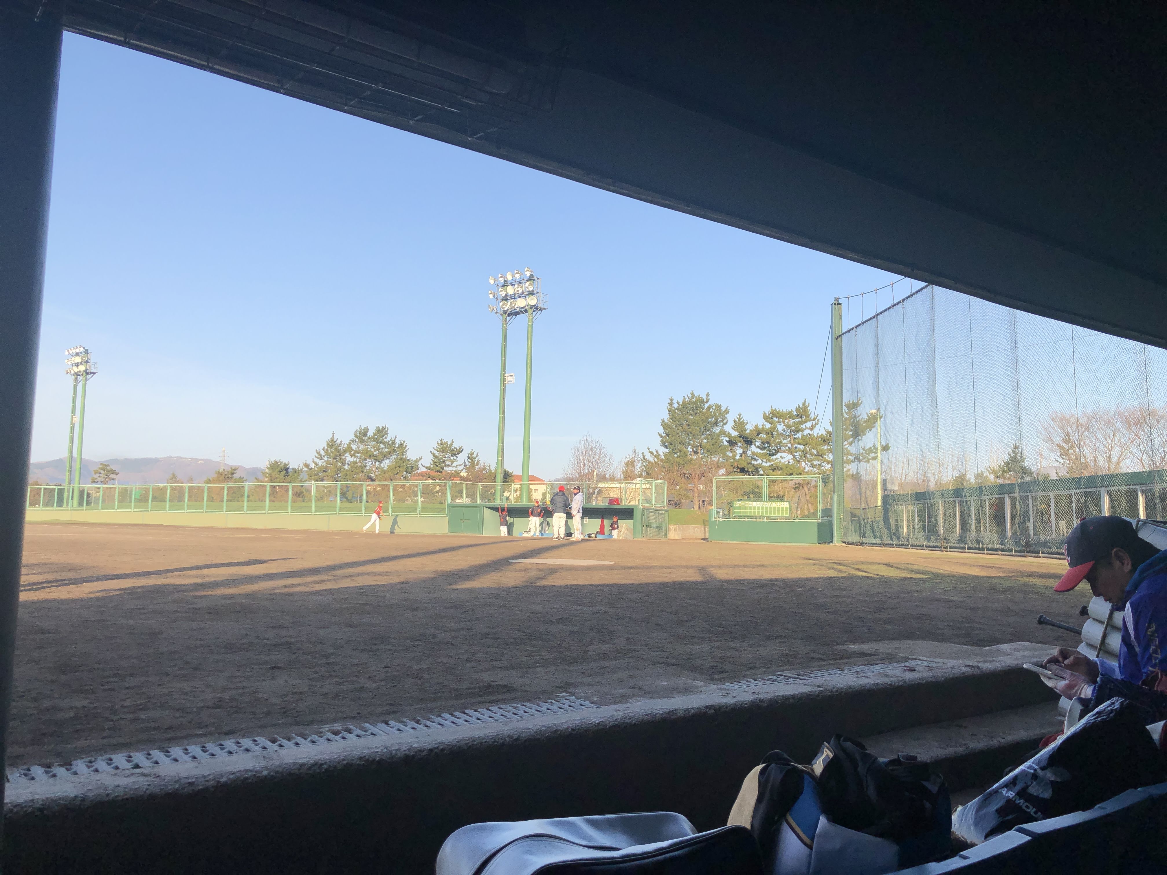 Staring down the other team from the dugout (Tsuyoshi and I would get traded before the game so I have mixed feelings about glaring at them before that event)
