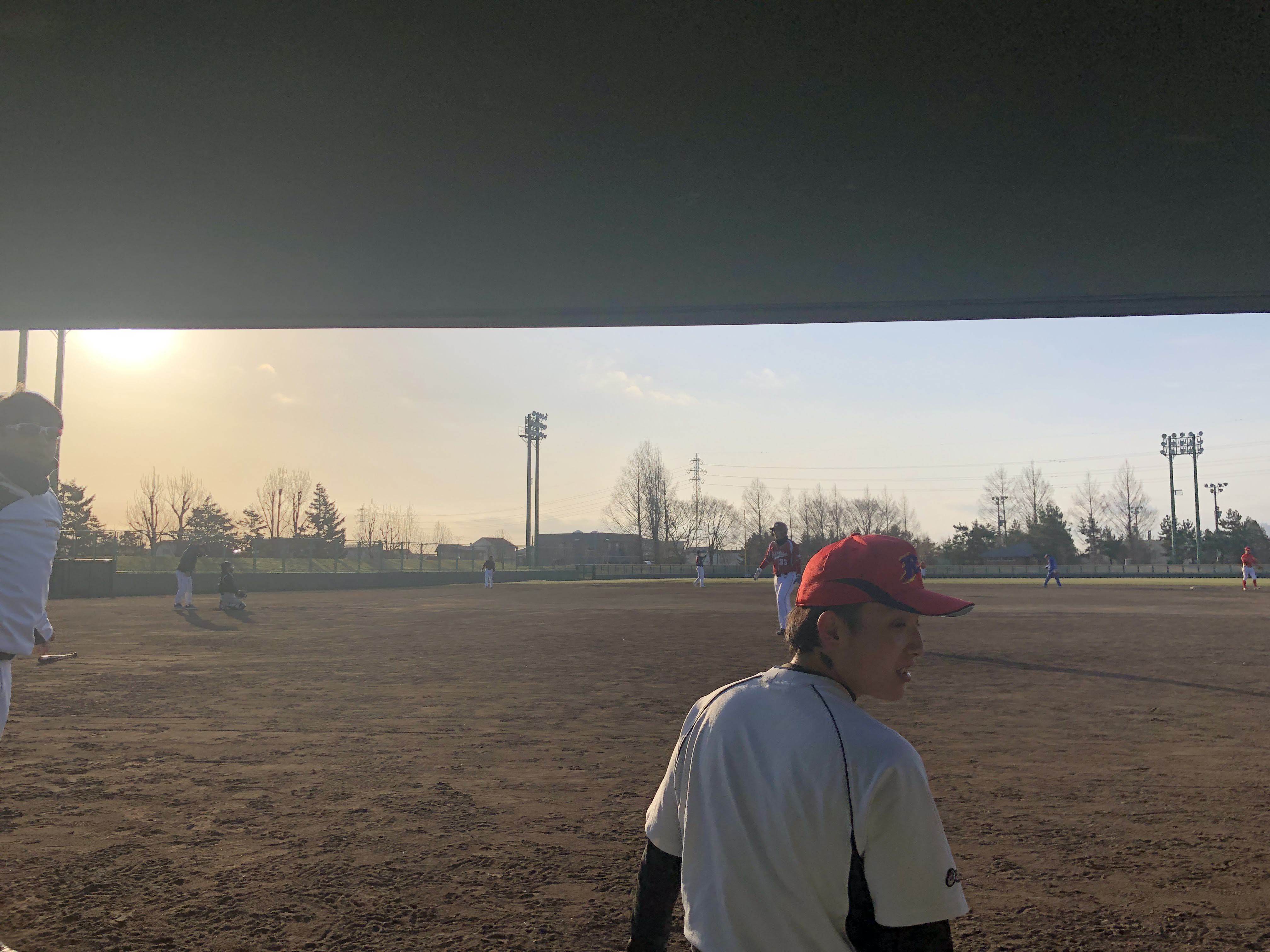 A bit after sunrise, mid-way through the game (our center fielder in front, a super nice guy)